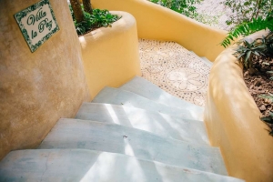 amor-boutique-hotel-la-paz-curved-stairs-yellow-blue