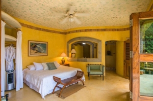 amor-boutique-hotel-la-paz-master-bedroom-open-wood-doors