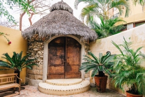 amor-boutique-hotel-la-paz-palapa-roof-huge-metal-doors